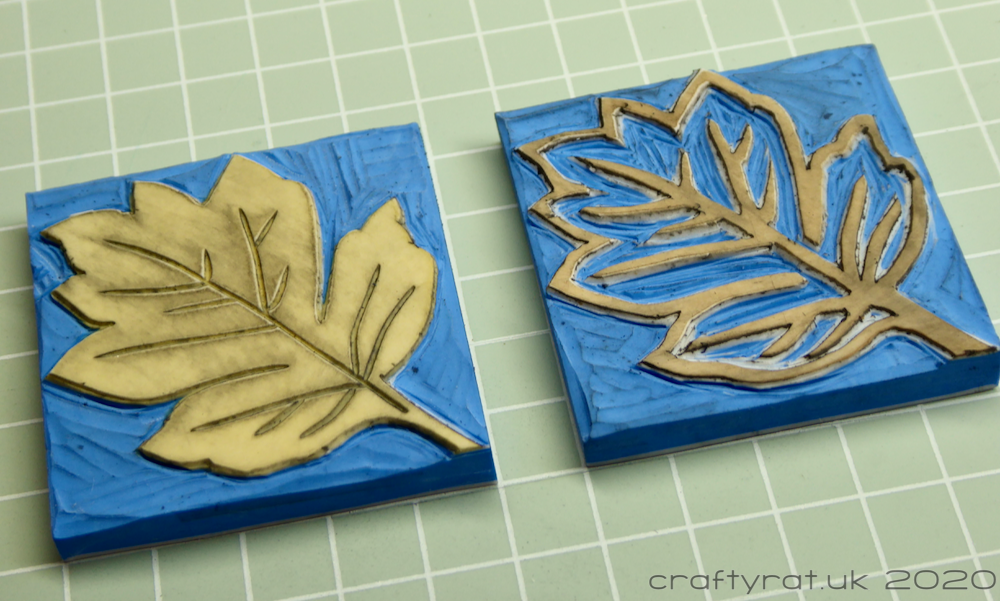 Two carved blocks: the original solid leaf design and a matching outline leaf design.