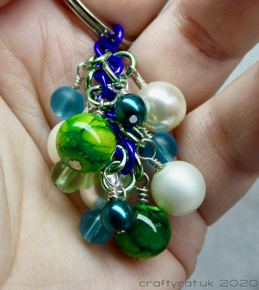 The beaded "dangle" held in a hand.