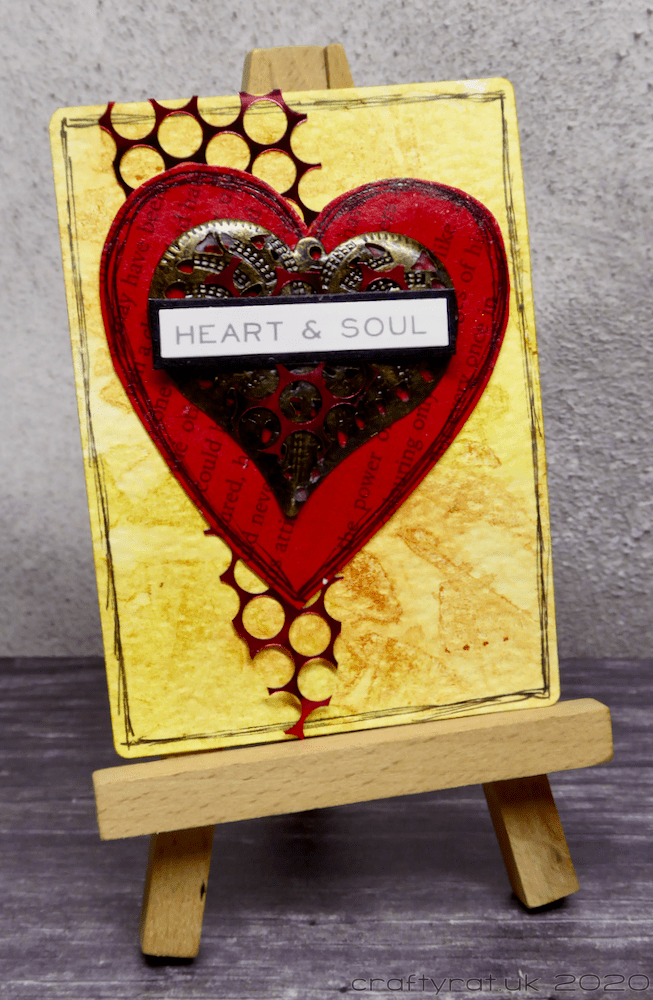 The art card displayed on a mini easel.