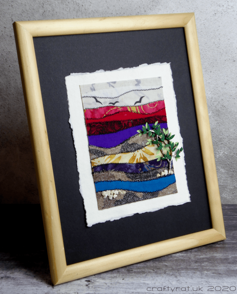 Framed fabric landscape.