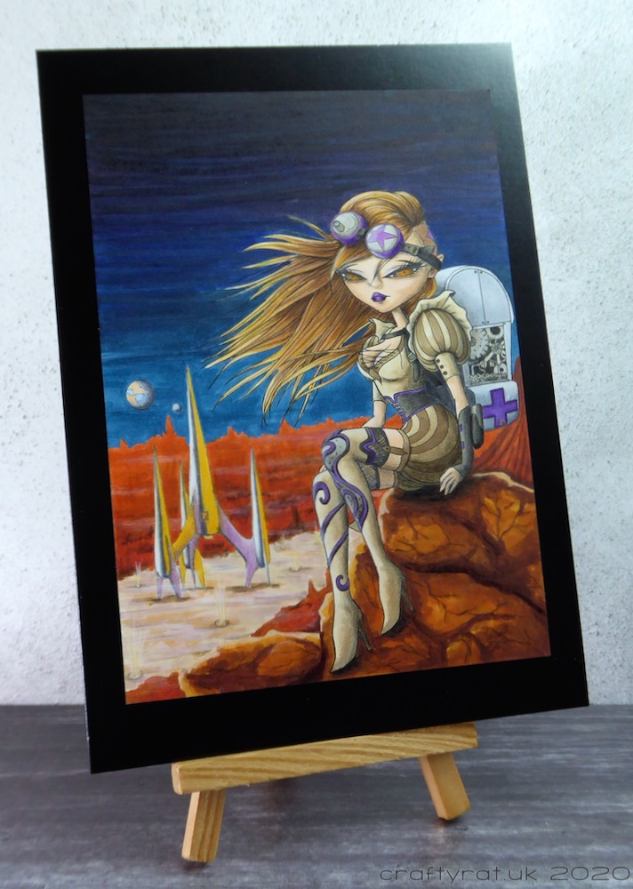 Steampunk-style space card displayed on a mini wooden easel.