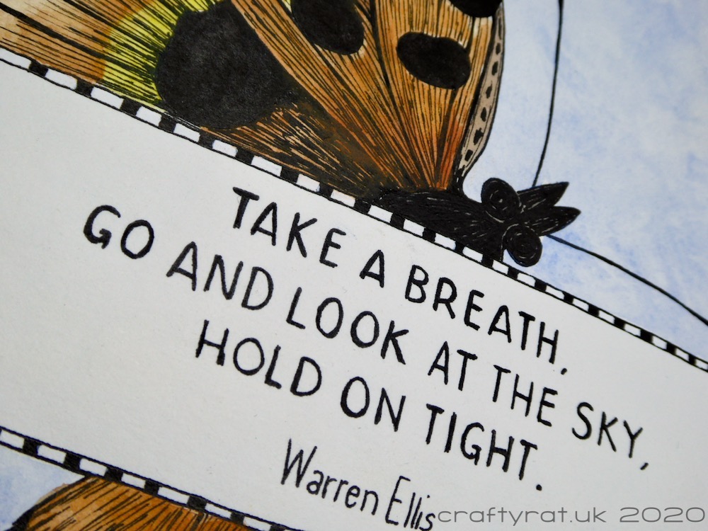 Close-up of the Warren Ellis quote: "Take a breath, go and look at the sky, hold on tight."