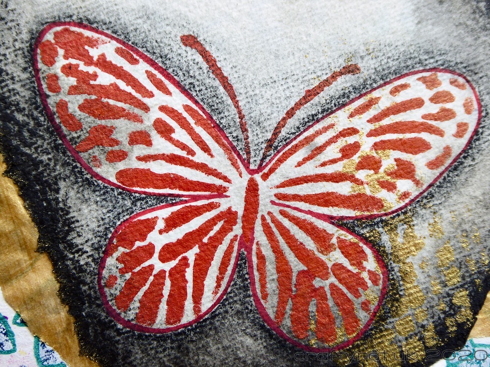 Close-up of one of the red stencilled butterflies.