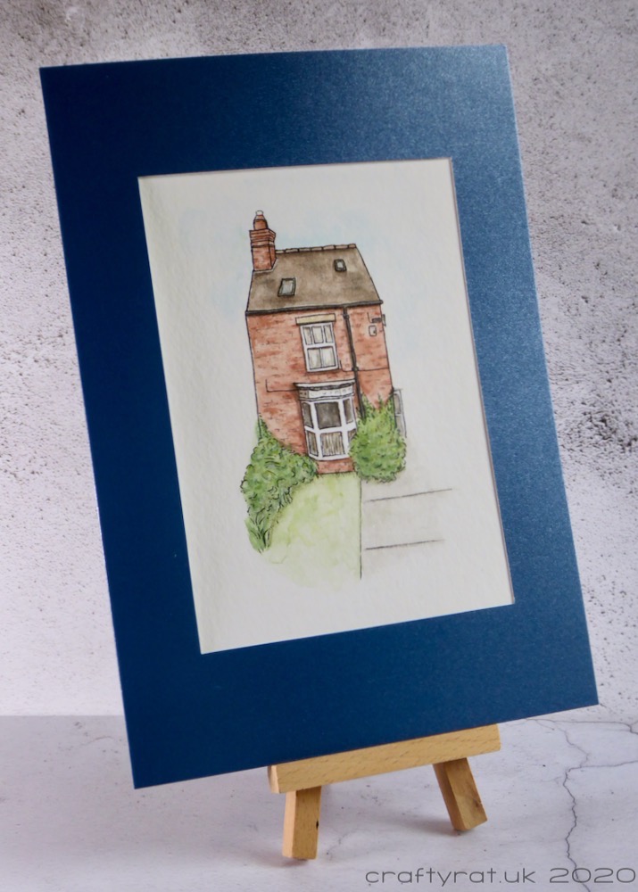 The card displayed on a small wooden easel.