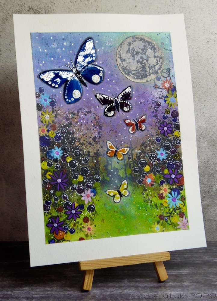 The artwork displayed on a small wooden easel.