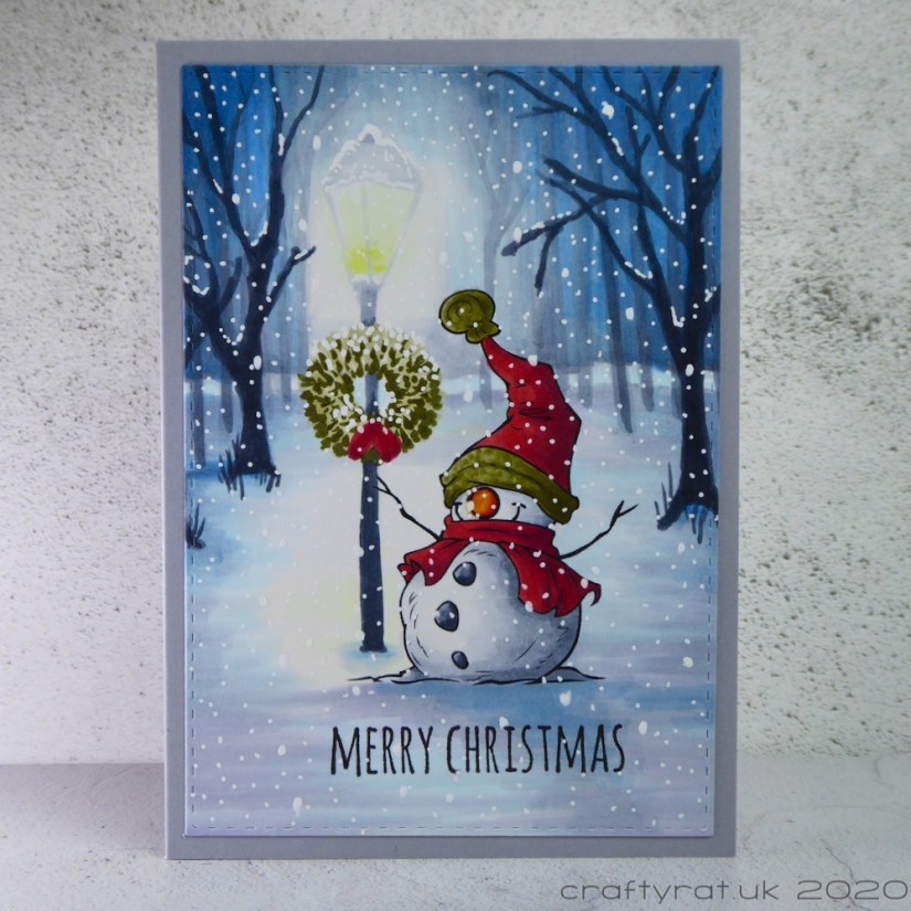 Copic-coloured snowman standing by a lamp in a snowy park.