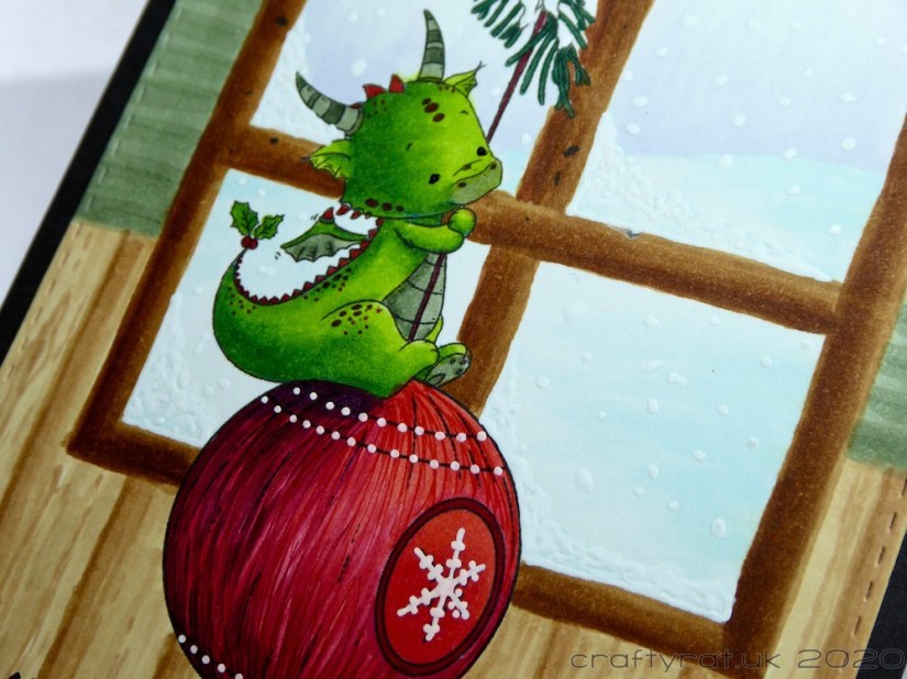 A close-up of the dragon on the bauble.