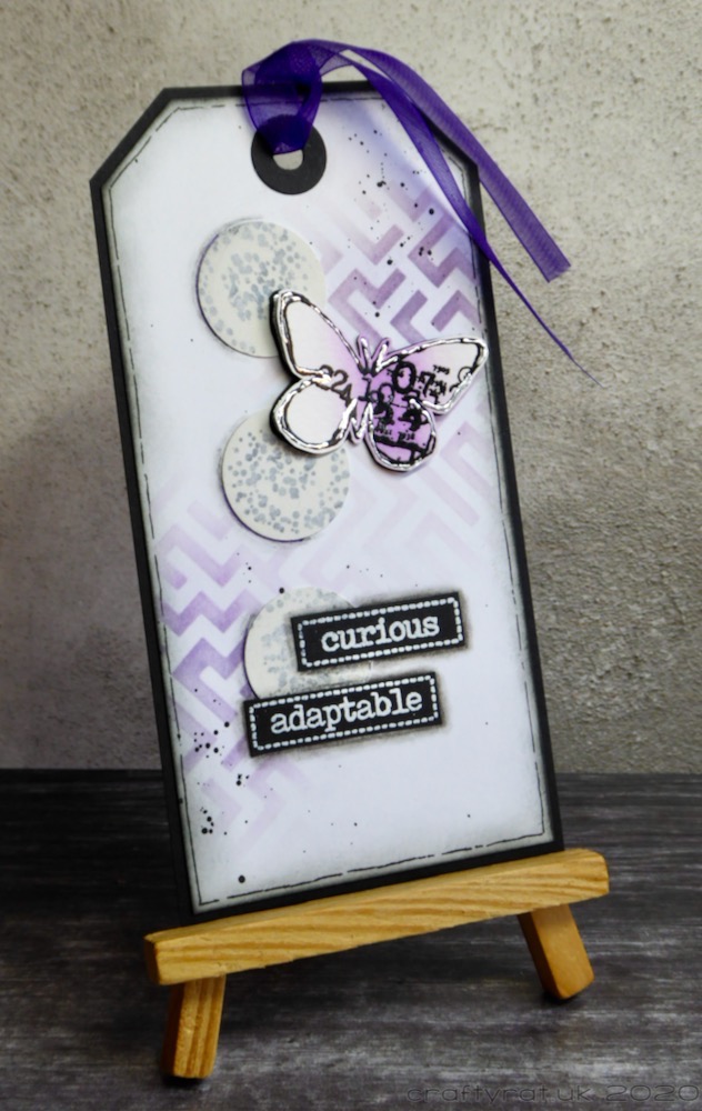 The tag displayed on a small wooden easel.