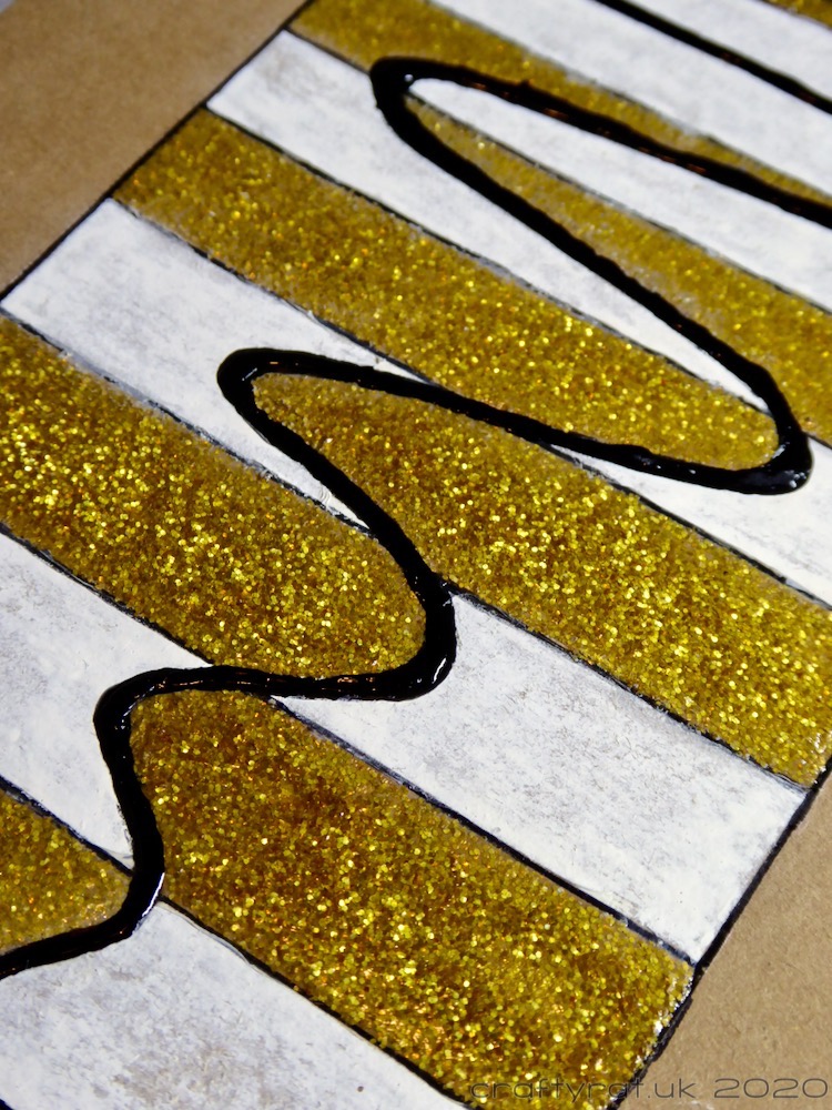 Close-up of the stripes and squiggle.