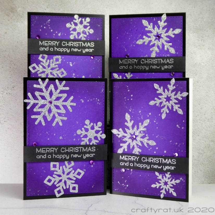 All four variants of the Christmas card design with the snowflakes and sentiment banner in different positions on each card.