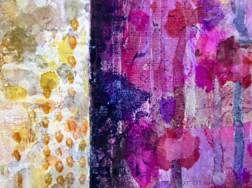 A close-up of the paint layers where the neutral and purple panels meet.