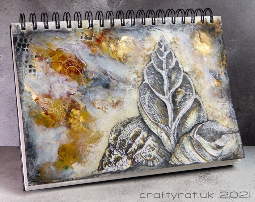 The art journal page displayed at an angle.