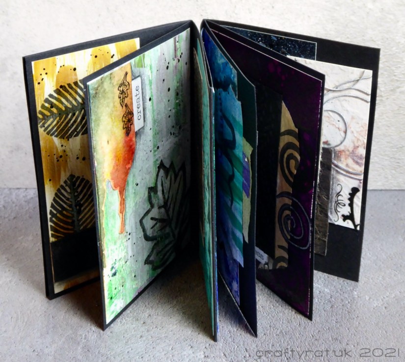 A view of the journal stood up with its pages fanned out.