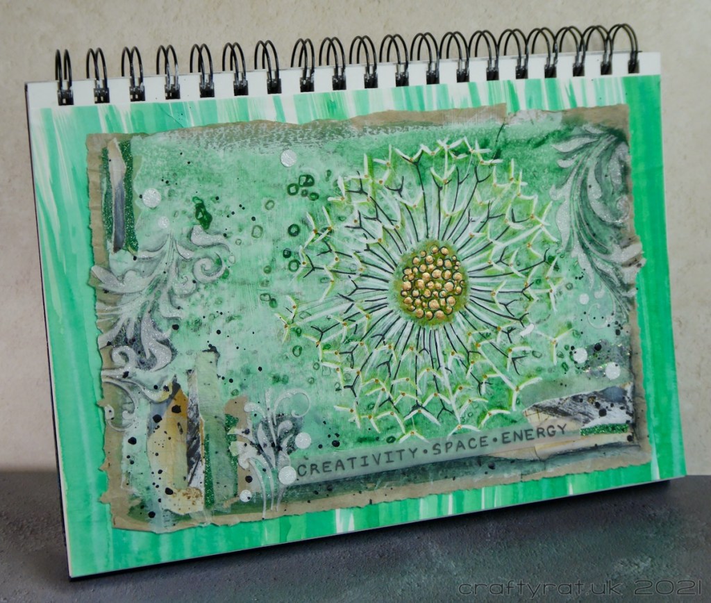 The art journal page displayed at an angle.