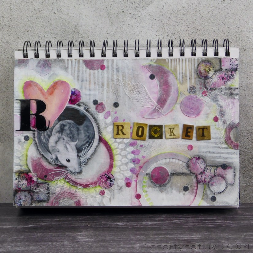 An art journal page for a rat named Rocket.